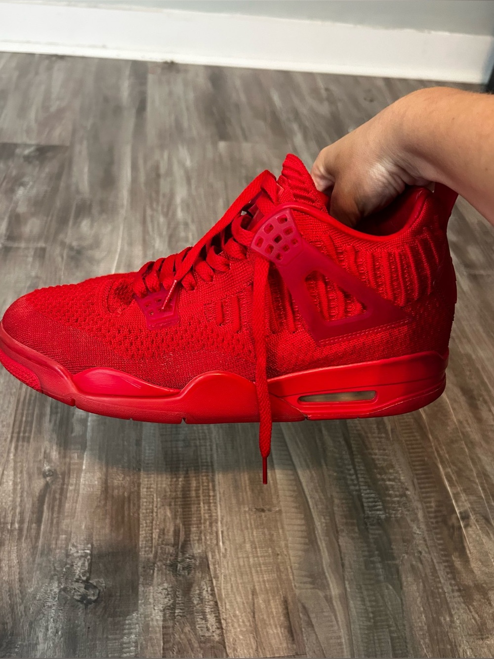 Men’s size 10.5 Jordan 4 Flyknit University Red.
